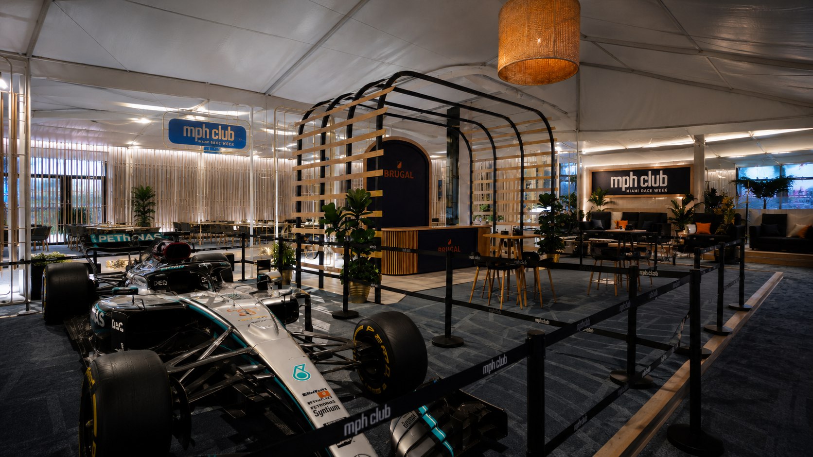 Brugal branded wood lattice lounge with a Formula 1 show car at a Miami event
